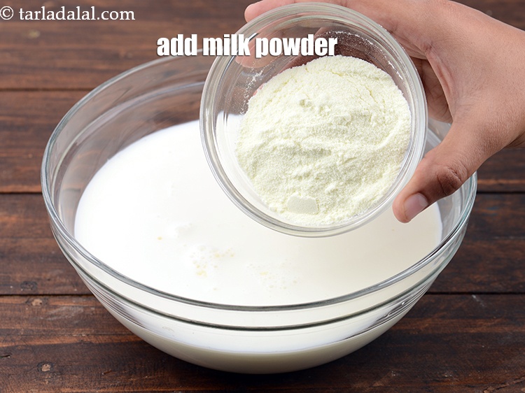 Step 23 – Add &frac14; cup <a href="https://www.tarladalal.com/glossary-milk-powder-517i">milk powder</a>.