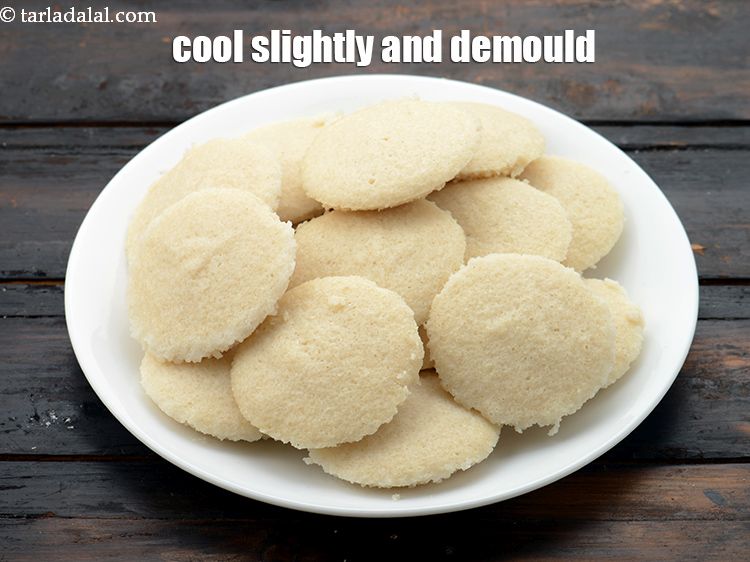 Step 28 – Allow the idlis to cool slightly and demould them.