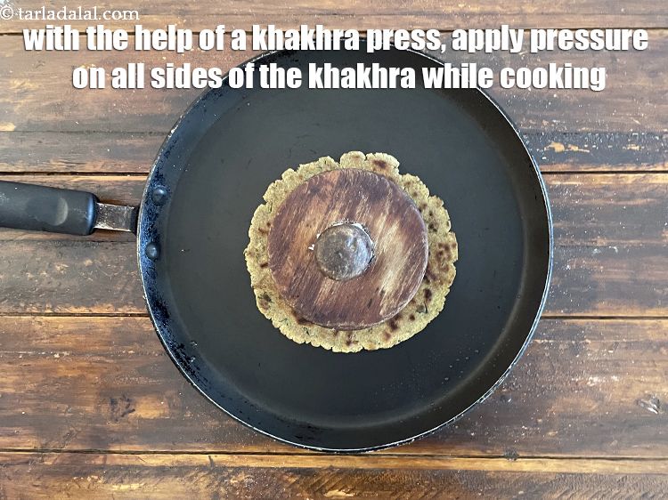 Step 29 – With the help of a khakhra press or &nbsp;folded muslin cloth, press the khakhra from …