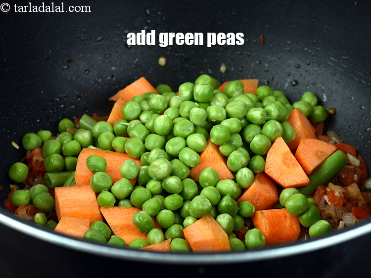Step 24 – Add &frac12; cup <a href="https://www.tarladalal.com/glossary-green-peas-matar-hare-matar-vatana-180i">green peas</a>.