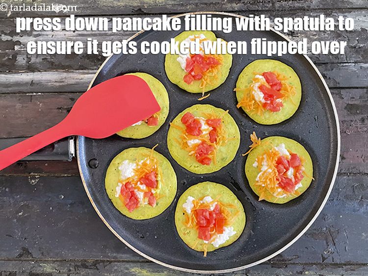 Step 23 – Press down pancake filling lightly with spatula while it's being cooked.