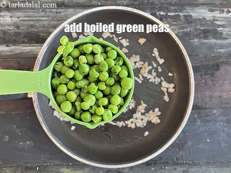 Step 23 – Add&nbsp;<meta charset="UTF-8" />1/2 cup&nbsp;<a href="glossary-boiled-green-peas-1078i">boiled green peas</a>.