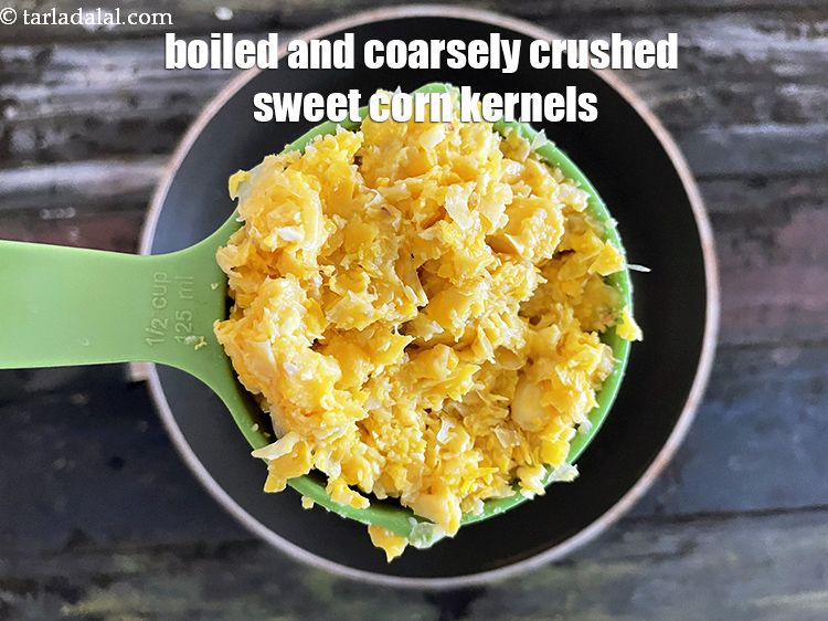 Step 34 – Add&nbsp;<meta charset="UTF-8" />3/4 cup&nbsp;boiled and coarsely&nbsp;<a href="glossary-boiled-and-crushed-sweet-corn-kernels-1930i">crushed sweet corn kernels (makai ke dane)</a>.