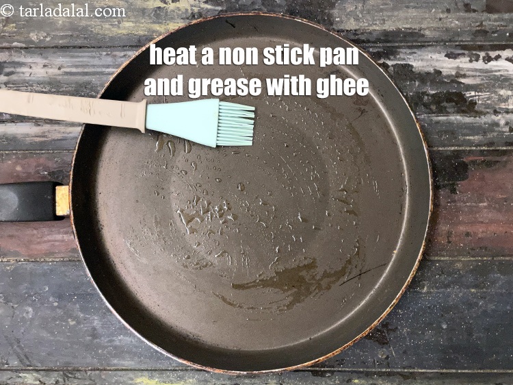 Step 31 – Heat a non-stick tava (griddle) and grease it with ghee.