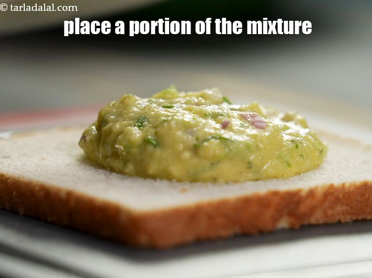 Step 23 – Place&nbsp;a portion of the mixture on each bread slice.