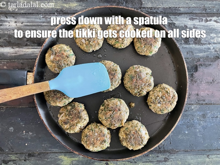 Step 38 – While cooking, use a spatula to press down on the tikki to ensure it gets …
