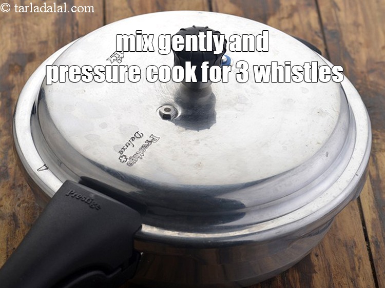 Step 26 – Mix gently and pressure cook on a high flame for 3 whistles.