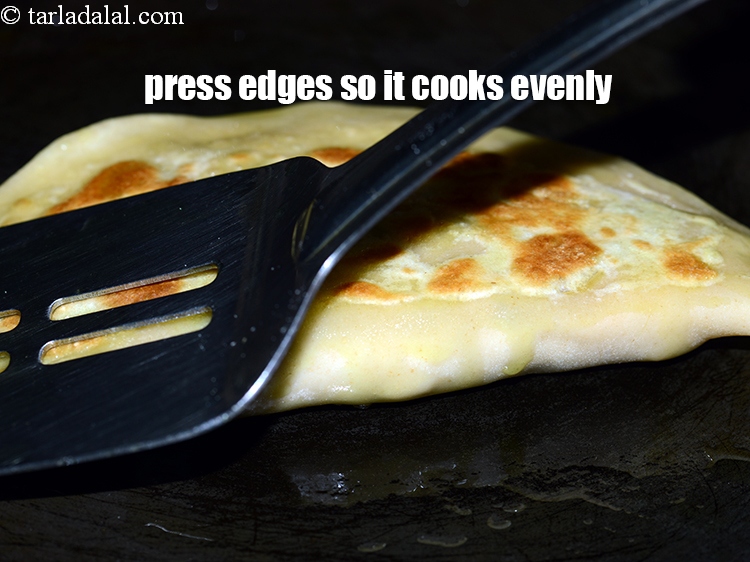 Step 28 – Press the edges while cooking so that it cooks evenly from all sides.