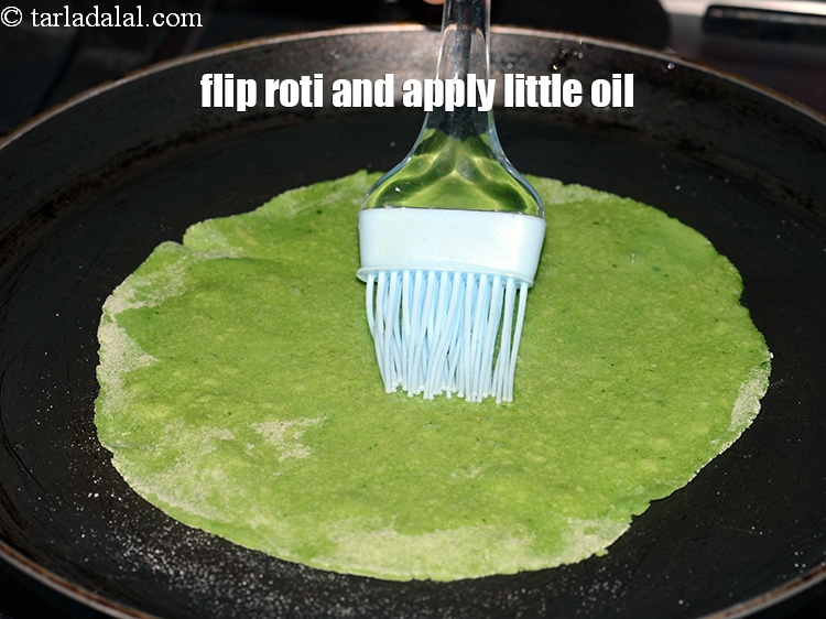 Step 23 – Flip the roti and apply a little oil all over.