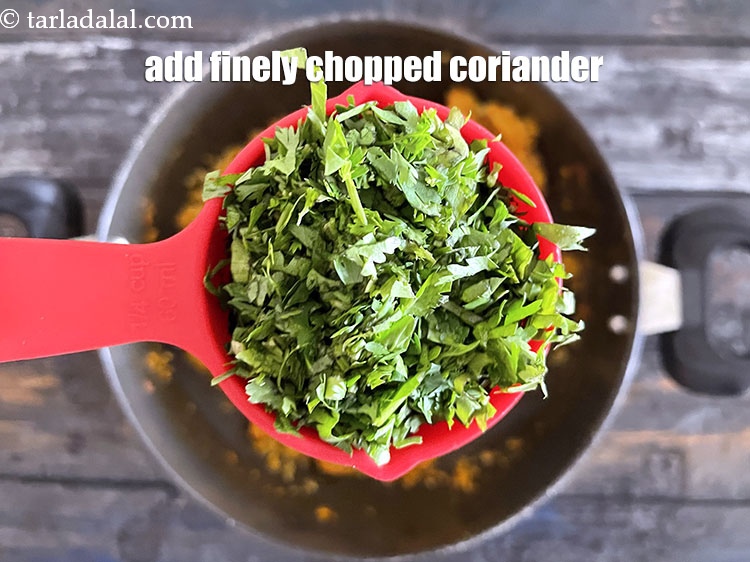 Step 26 – Add&nbsp;<meta charset="UTF-8" />1/4 cup&nbsp;finely&nbsp;<a href="glossary-chopped-coriander-783i">chopped coriander (dhania)</a>.
