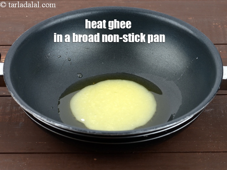 Step 24 – Heat &frac14; cup ghee, in a broad non-stick pan.