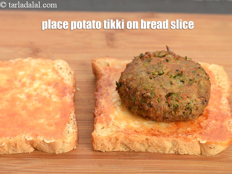 Step 24 – Place the potato tikki on a bread slice.