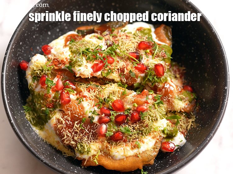 Step 23 – Sprinkle &frac12; tbsp finely&nbsp;<a href="https://tarladalal.com/glossary-chopped-coriander-783i">chopped coriander (dhania)</a>.