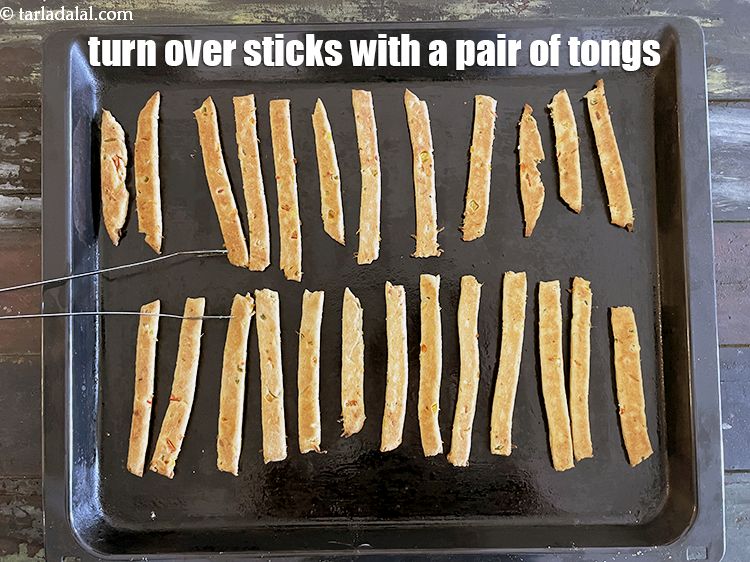 Step 23 – Turn the straws over with a pair of tongs.