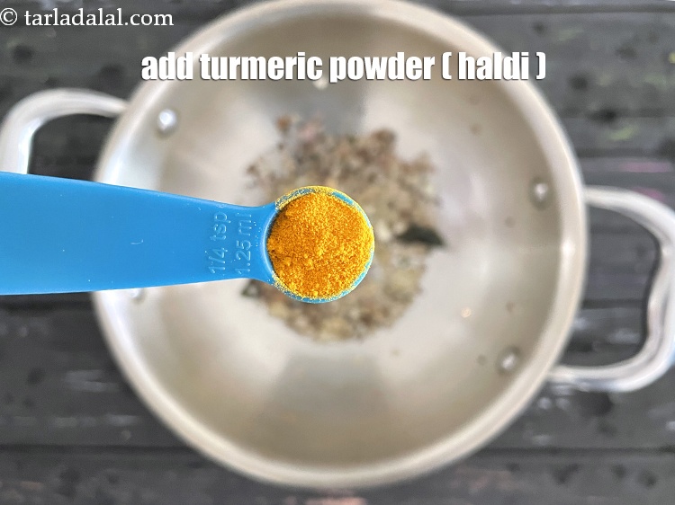 Step 23 – Add&nbsp;<meta charset="UTF-8" />1/4 tsp&nbsp;<a href="glossary-turmeric-powder-haldi-645i">turmeric powder (haldi)</a>.