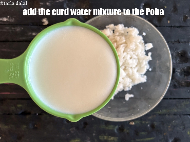 Step 24 – Add the curd water mixture to the poha.