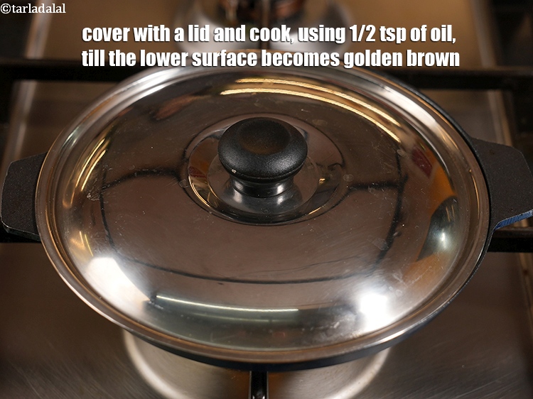 Step 26 – Cover with a lid and cook, using 1/2&nbsp;tsp of oil, till the lower surface becomes …