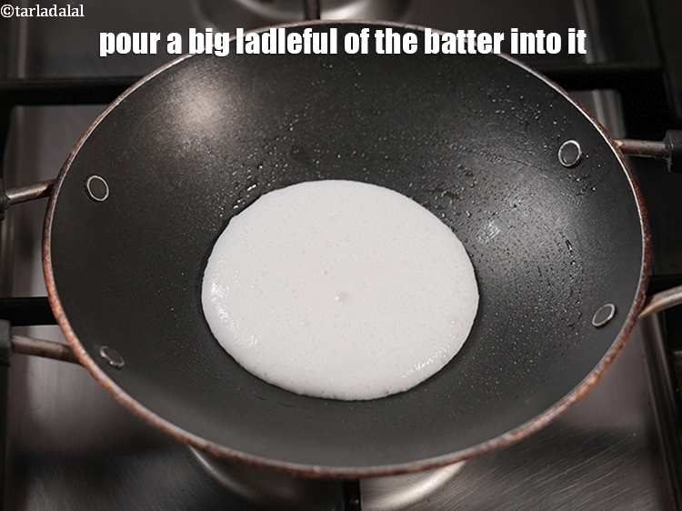 Step 33 – Pour a big ladleful of the batter into it.