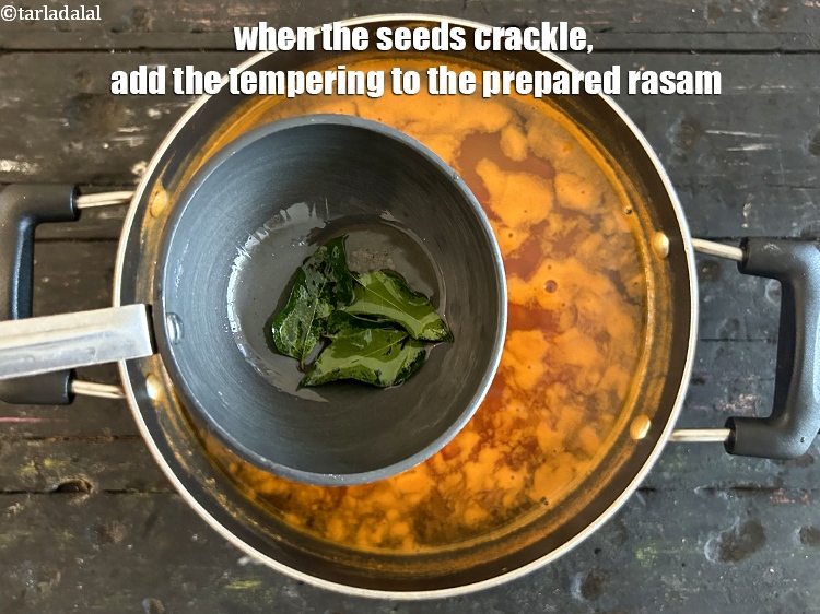 Step 26 – <meta charset="UTF-8" />When the seeds crackle, add the tempering to the prepared rasam.