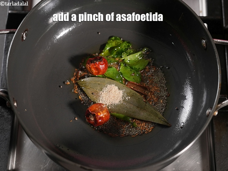 Step 24 – Add a pinch of asafoetida.&nbsp;