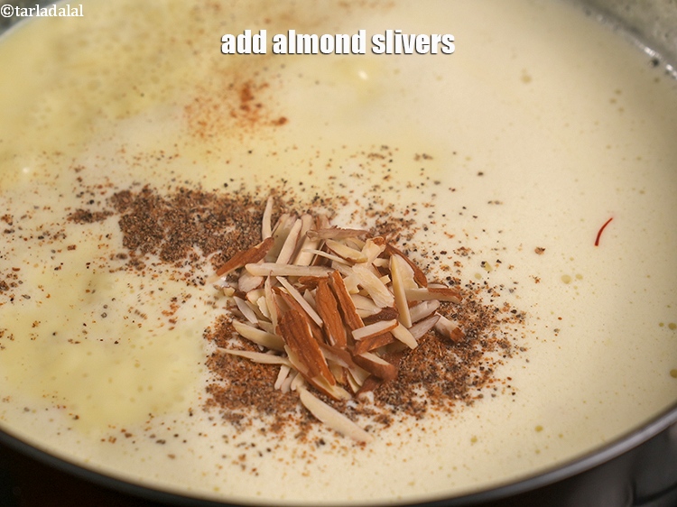 Step 24 – Add 1 tbsp <a href="https://www.tarladalal.com/glossary-almond-slivers-slivered-almonds-664i">almond (badam) slivers</a>.