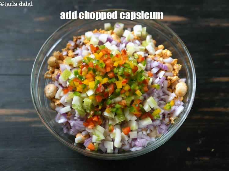 Step 24 – Add &frac14; cup finely <a href="https://www.tarladalal.com/glossary-chopped-capsicum-164i">chopped capsicum</a>.