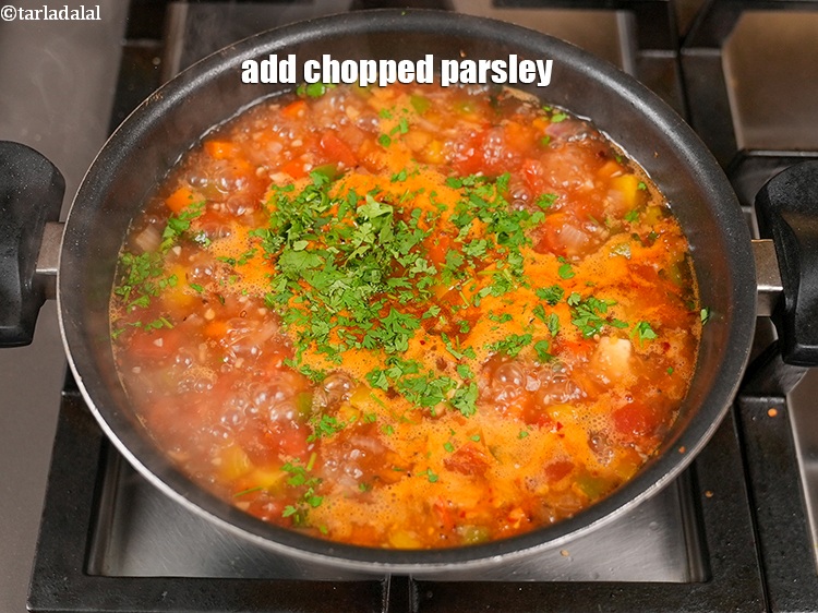 Step 23 – Add 1 tbsp <a href="https://www.tarladalal.com/glossary-chopped-parsley-793i">chopped parsley</a>.