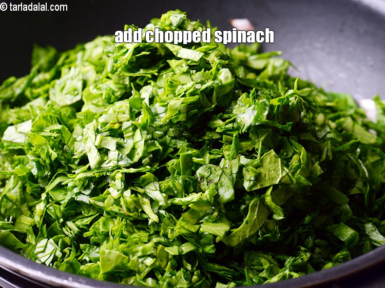 Step 25 – Add 6 cups <a href="https://www.tarladalal.com/glossary-chopped-spinach-780i">chopped spinach (palak)</a>&nbsp;.