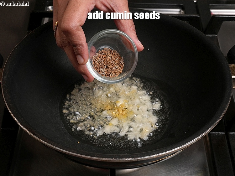 Step 24 – Add 1 tsp <a href="https://www.tarladalal.com/glossary-cumin-seeds-jeera-zeera-381i">cumin seeds (jeera)</a>.