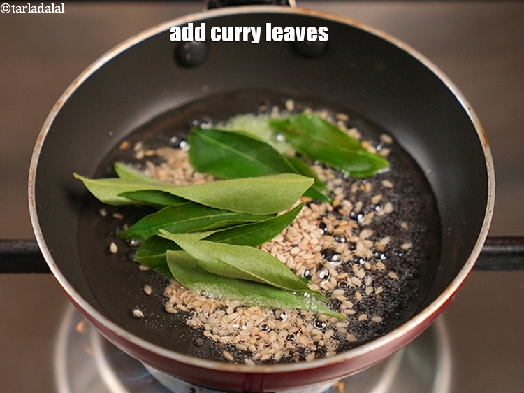 Step 32 – Add 10 to 12 curry leaves.