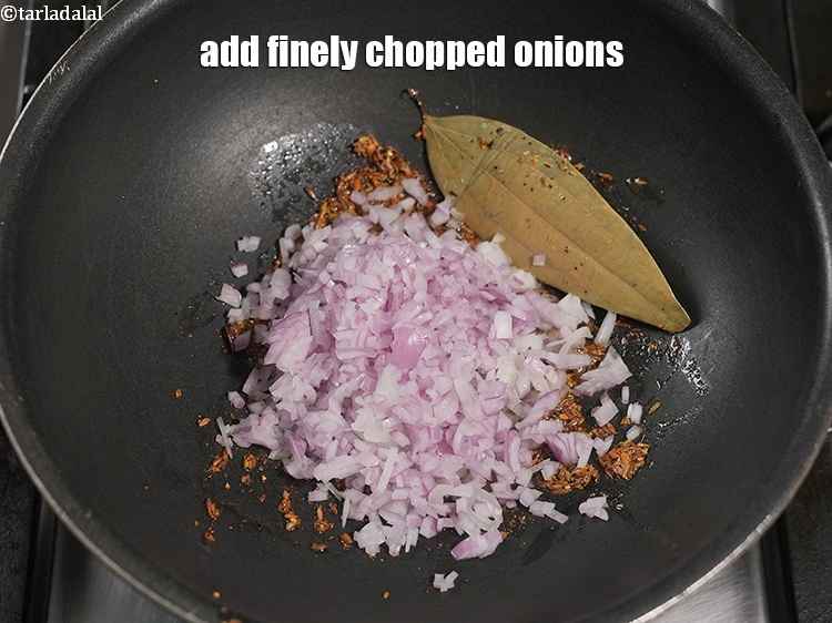 Step 25 – Add &frac12; cup finely <a href="https://www.tarladalal.com/glossary-chopped-onions-722i">chopped onions</a>.