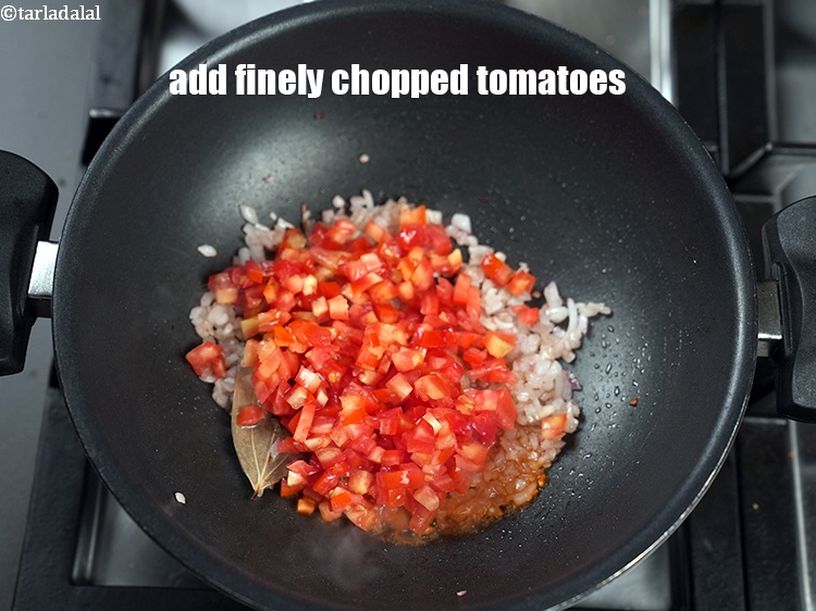 Step 24 – Add &frac12; cup finely&nbsp;<a href="https://www.tarladalal.com/glossary-chopped-tomatoes-779i">chopped tomatoes</a>.