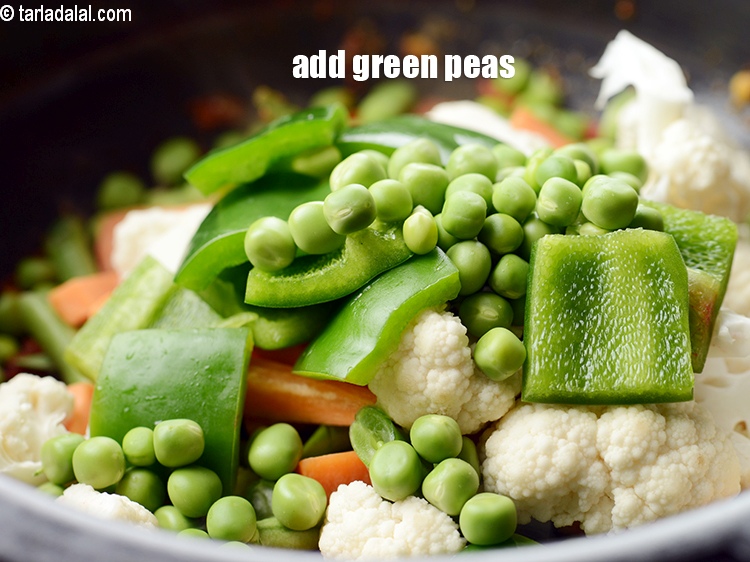 Step 24 – Add &frac14; cup <a href="https://www.tarladalal.com/glossary-green-peas-matar-hare-matar-vatana-180i">green peas</a>.