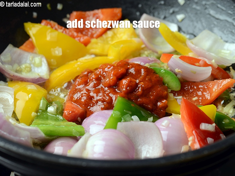 Step 25 – Add 3 tbsp&nbsp;<a href="https://www.tarladalal.com/glossary-schezwan-sauce-schezuan-sauce-1872i">schezwan sauce</a>.