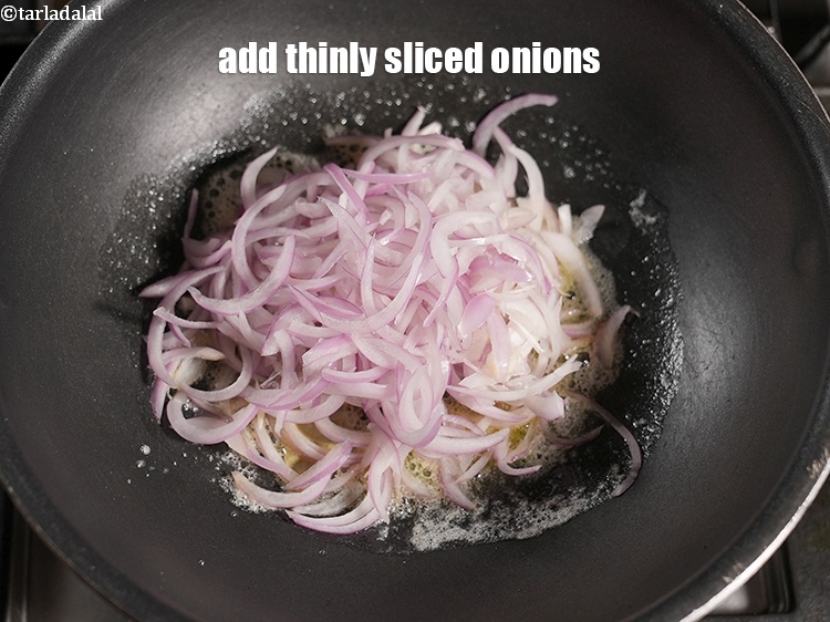 Step 25 – Add 1 cup thinly <a href="https://www.tarladalal.com/glossary-sliced-onions-745i">sliced onions</a>.