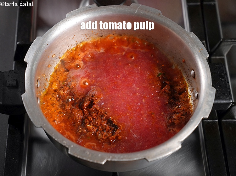 Step 24 – Add 1 cup&nbsp;<a href="https://www.tarladalal.com/glossary-tomato-pulp-tamatar-ka-pulp-1039i">tomato pulp</a>.