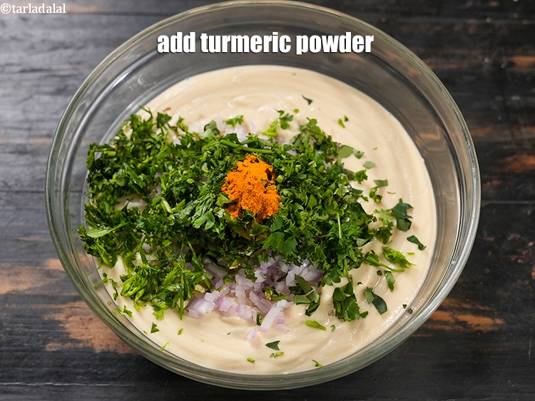 Step 24 – Add &frac14; tsp <a href="https://www.tarladalal.com/glossary-turmeric-powder-haldi-645i">turmeric powder (haldi)</a>.