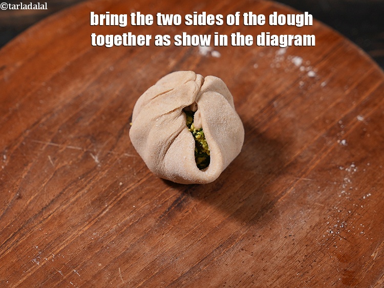 Step 27 – Bring the two&nbsp;sides of the dough together as show in the diagram.