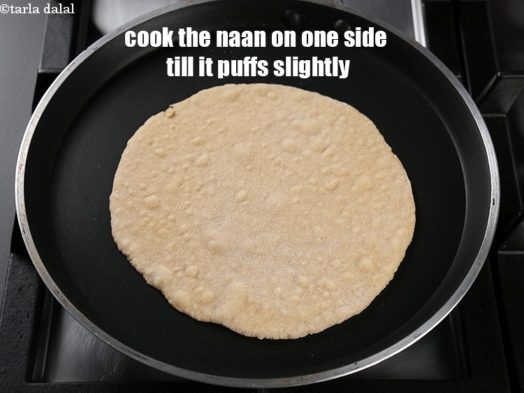 Step 24 – Cook the naan on one side till it puffs slightly.