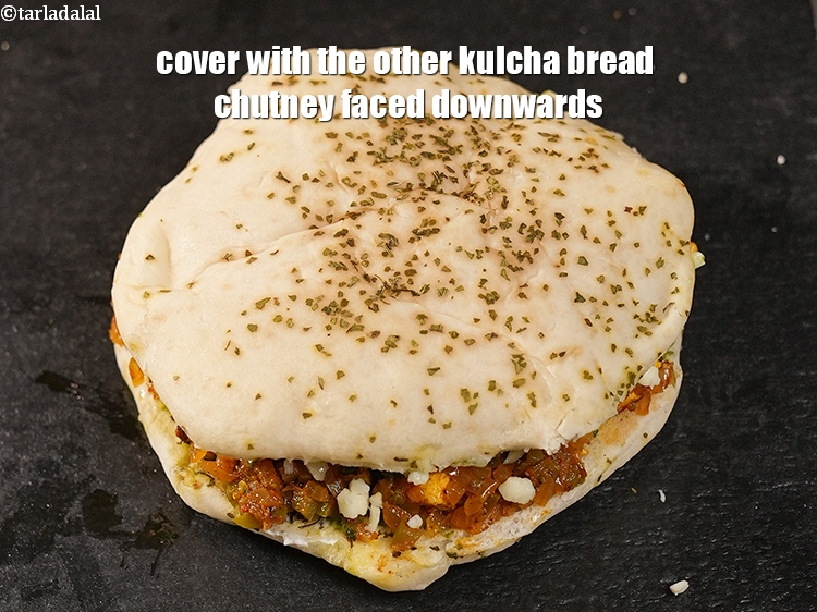 Step 24 – Cover with the other kulcha bread chutney faced downwards.&nbsp;