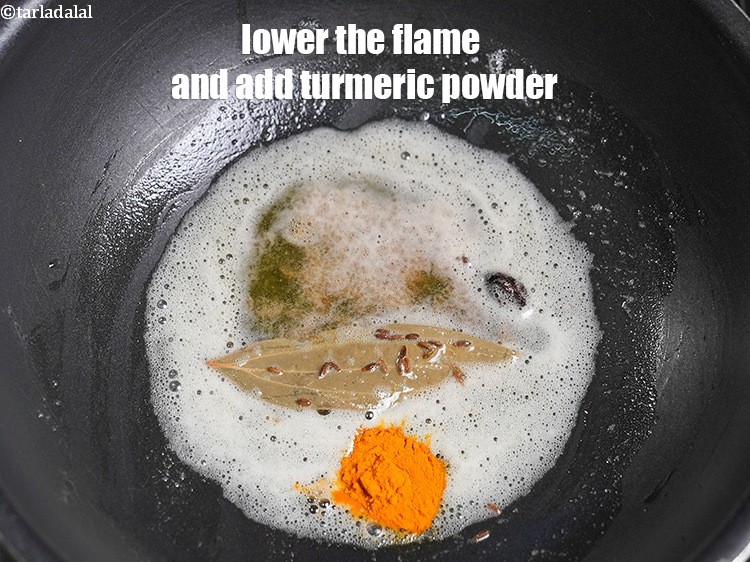 Step 24 – Lower the flame and add &frac12; tsp <a href="https://www.tarladalal.com/glossary-turmeric-powder-haldi-645i">turmeric powder (haldi)</a>.