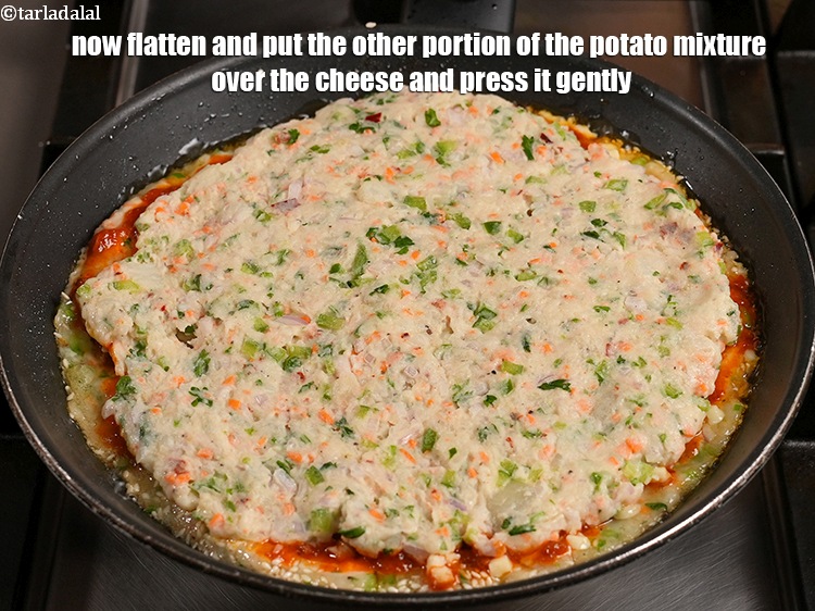 Step 24 – Now flatten and put the other portion of the potato mixture over the cheese and …