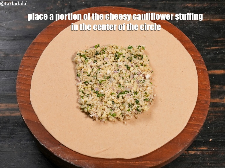 Step 24 – Place a portion of the cheesy cauliflower stuffing in the center of the circle.