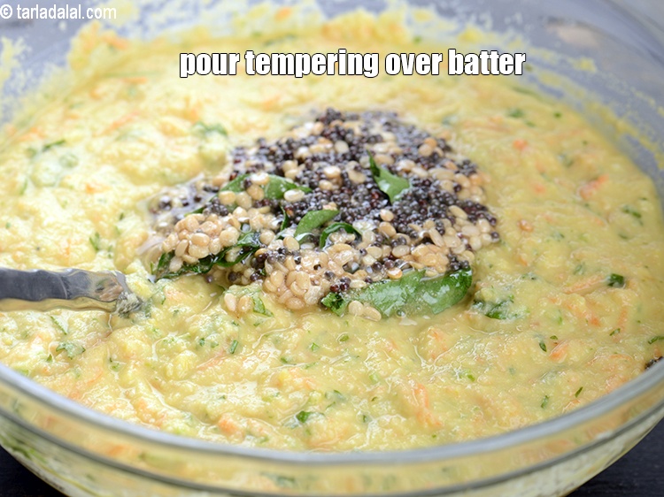 स्टेप 24 – तड़के को बैटर के ऊपर डालें।