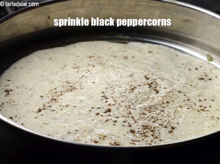 Step 25 – Sprinkle little <a href="https://www.tarladalal.com/glossary-black-peppercorns-kali-mirch-kalimirch-566i">black peppercorns (kalimirch)</a>&nbsp;.