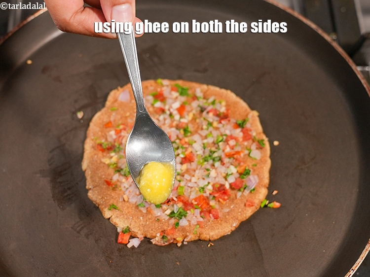 Step 25 – Using &frac12; tsp ghee on both the sides.<br /> &nbsp;
