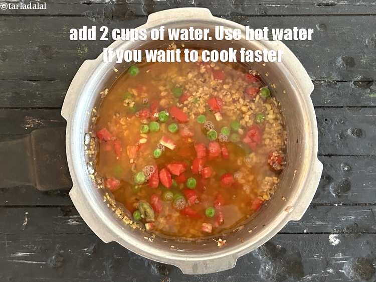 Step 27 – <p>Add&nbsp;2 cups of water. Use hot water if you want to cook faster.</p>