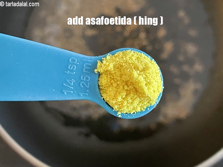 Step 24 – Add&nbsp;<meta charset="UTF-8" />1/4 tsp&nbsp;<a href="glossary-asafoetida-hing-113i">asafoetida (hing)</a>.