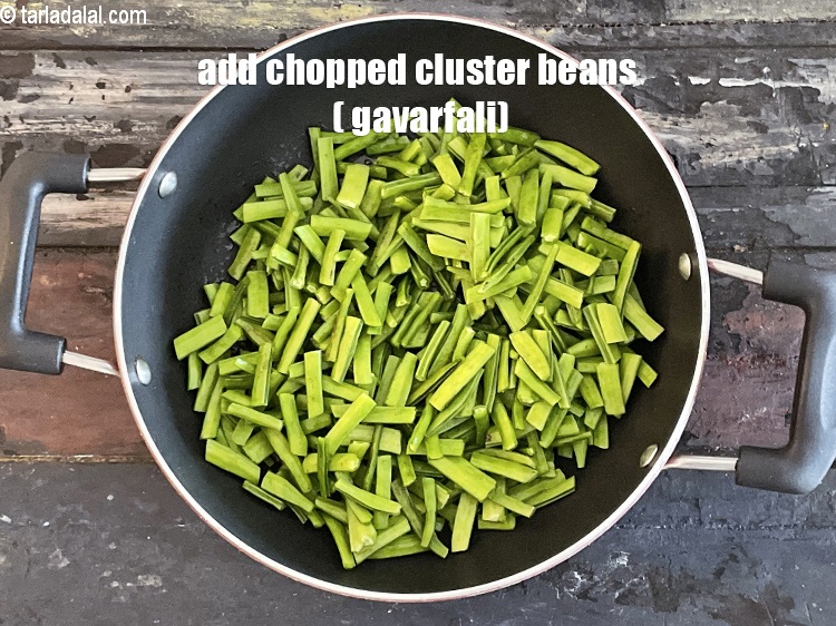 Step 24 – Add&nbsp;<meta charset="UTF-8" />2 cups&nbsp;<a href="glossary-cluster-beans-gavarfali-guar-704i">cluster beans (gavarfali)</a>&nbsp;, cut into 25 mm. (1") pieces.