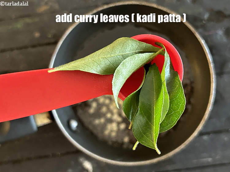 Step 26 – Add<strong>&nbsp; </strong><meta charset="UTF-8" />6 to 8&nbsp;<a href="glossary-curry-leaves-kadi-patta-kadipatta-388i">curry leaves (kadi patta)</a>.